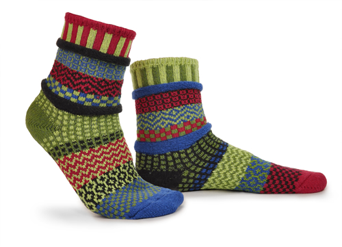 mismatched socks with dark reds, light and dark green, turquoise, little orange and yellow.